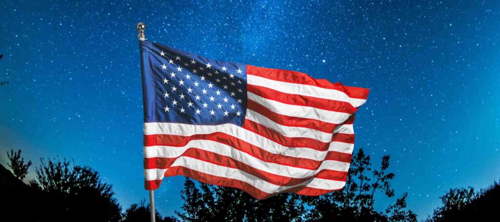 American flag in front of a starry sky