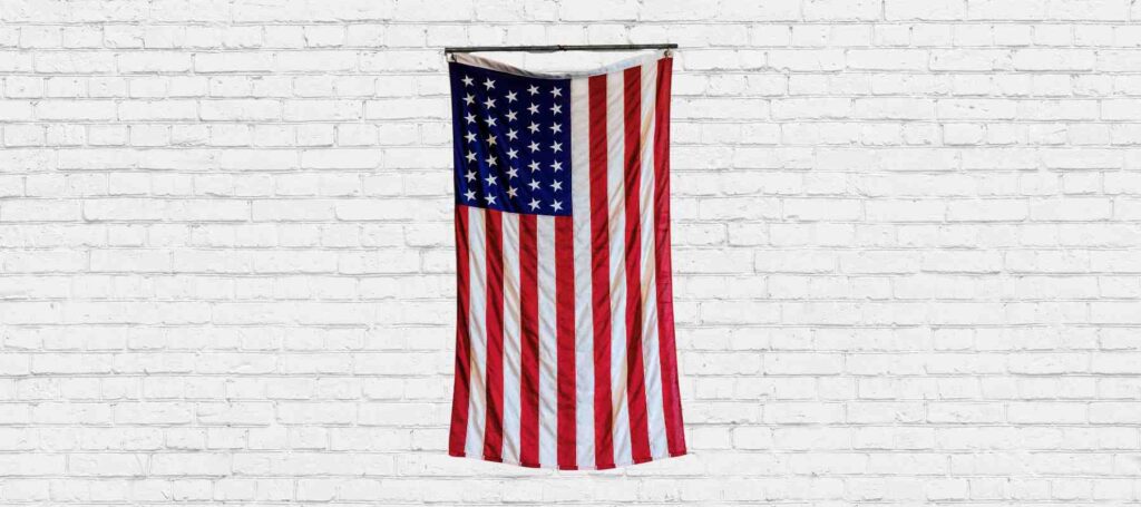 American flag hanging vertically on a wall